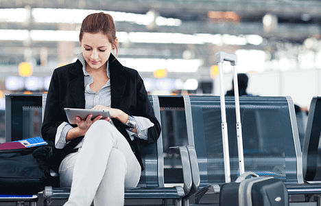 shutterstock_102068095-woman-with-tablet-at-airport-web2